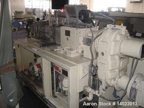 Used Krauss Maffei KMD 2-50 KK Conical Extruder.  Counter-rotating, screw diameter 2" - 4" (50 - 103 mm), screw length 41.7" (1060 mm), screw sped 4.3 - 43 rpm, 33.3 hp/25 kW drive, 400/50/3.  Produc...