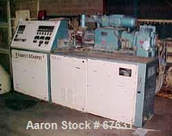 Used Krauss Maffei 50mm Counter-Rotating Twin Screw Extruder, Type KMD-2-50KK. (2) 50 mm diameter screws. Dosing feeder. Gearbox is direct driven by a 30 hp DC motor. Integral panel has 8 zones of di...