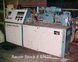 Used Krauss Maffei 50mm Counter-Rotating Twin Screw Extruder, Type KMD-2-50KK. (2) 50 mm diameter screws. Dosing feeder. Gearbox is direct driven by a 30 hp DC motor. Integral panel has 8 zones of di...