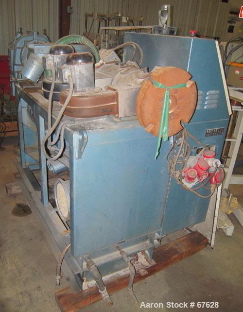 Used Krauss Maffei 40mm Counter-Rotating Twin Screw Extruder, Type KMD2-40KK. (2) 40 mm diameter screws. Gearbox is direct driven by a 25 hp DC motor. Integral panel has 8 zones of RKC digital contro...