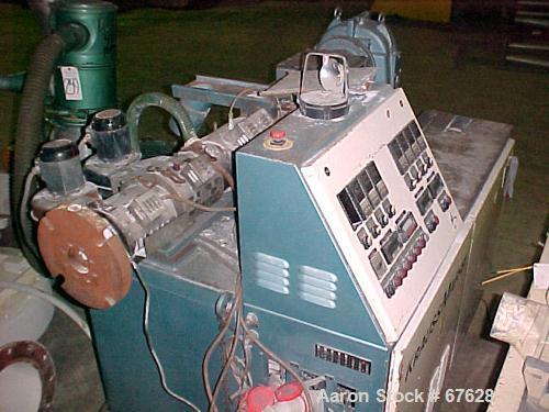 Used Krauss Maffei 40mm Counter-Rotating Twin Screw Extruder, Type KMD2-40KK. (2) 40 mm diameter screws. Gearbox is direct driven by a 25 hp DC motor. Integral panel has 8 zones of RKC digital contro...