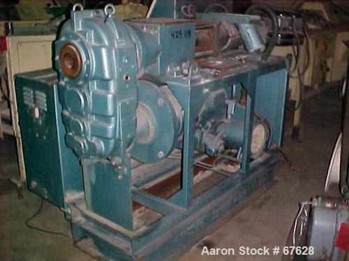 Used Krauss Maffei 40mm Counter-Rotating Twin Screw Extruder, Type KMD2-40KK. (2) 40 mm diameter screws. Gearbox is direct driven by a 25 hp DC motor. Integral panel has 8 zones of RKC digital contro...