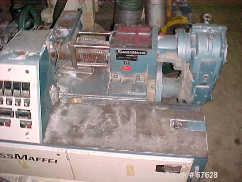 Used Krauss Maffei 40mm Counter-Rotating Twin Screw Extruder, Type KMD2-40KK. (2) 40 mm diameter screws. Gearbox is direct driven by a 25 hp DC motor. Integral panel has 8 zones of RKC digital contro...