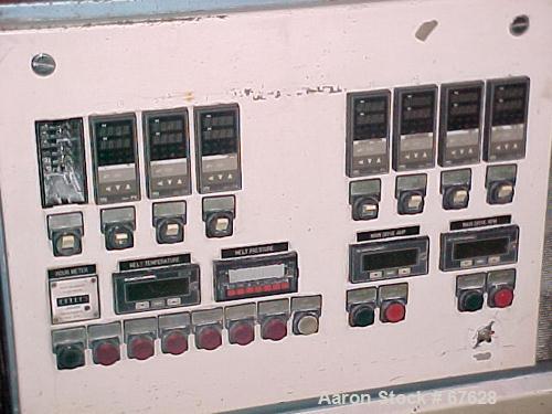 Used Krauss Maffei 40mm Counter-Rotating Twin Screw Extruder, Type KMD2-40KK. (2) 40 mm diameter screws. Gearbox is direct driven by a 25 hp DC motor. Integral panel has 8 zones of RKC digital contro...