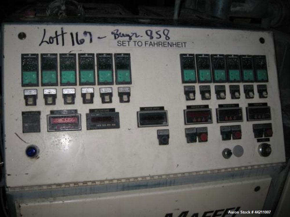 Used Krauss Maffei Model KMD2-50KK Counter-Rotating Twin Screw Extruder. 50 mm Diameter screws, 30 hp motor, 6 barrel and 8 die zones, serial #205325, year 1995.