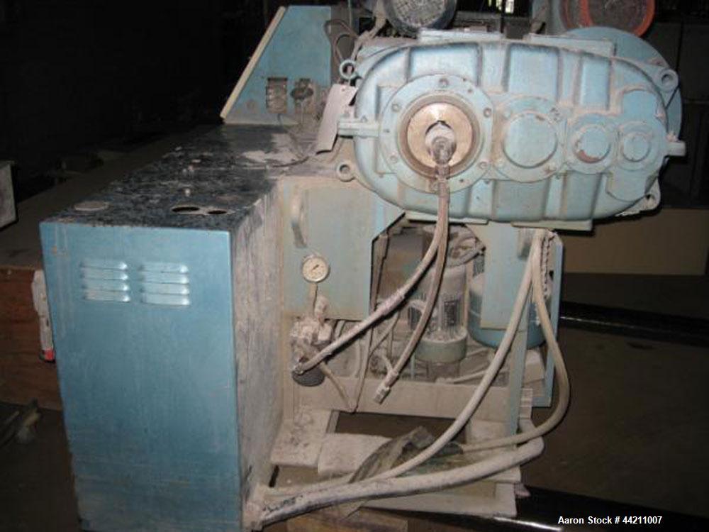 Used Krauss Maffei Model KMD2-50KK Counter-Rotating Twin Screw Extruder. 50 mm Diameter screws, 30 hp motor, 6 barrel and 8 die zones, serial #205325, year 1995.