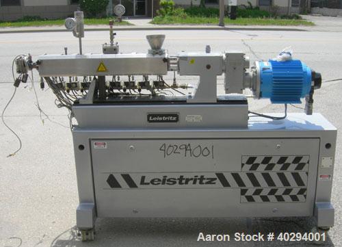 Used Leistritz Counter-Rotating 18 mm Twin Screw Extruder, Model MIC18/GG-40D. 8 Barrel sections, electrically heated, water cooled. Feed section with small hopper. Driven by a 3 hp, 3/60/120 hz, 230...