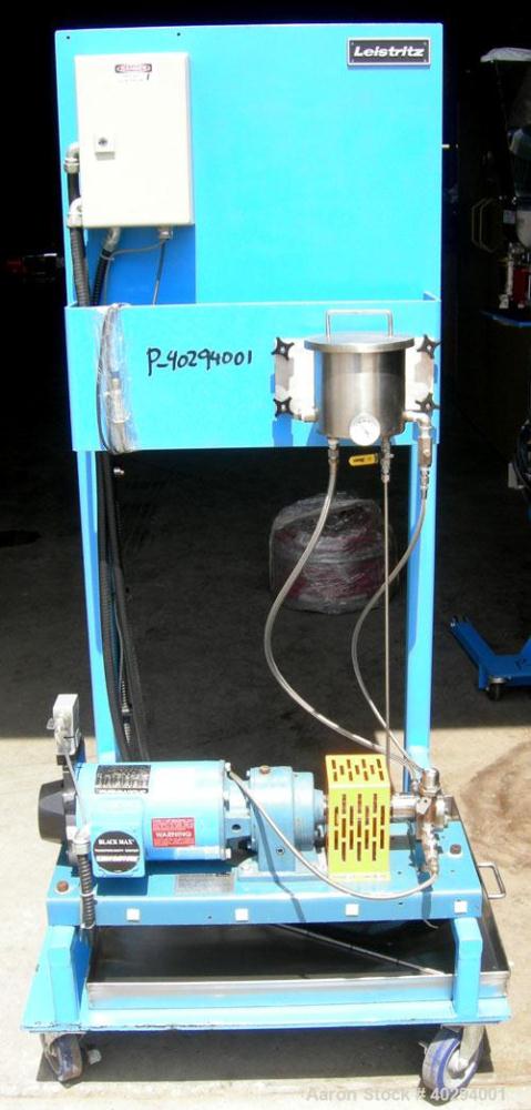 Used Leistritz Counter-Rotating 18 mm Twin Screw Extruder, Model MIC18/GG-40D. 8 Barrel sections, electrically heated, water cooled. Feed section with small hopper. Driven by a 3 hp, 3/60/120 hz, 230...