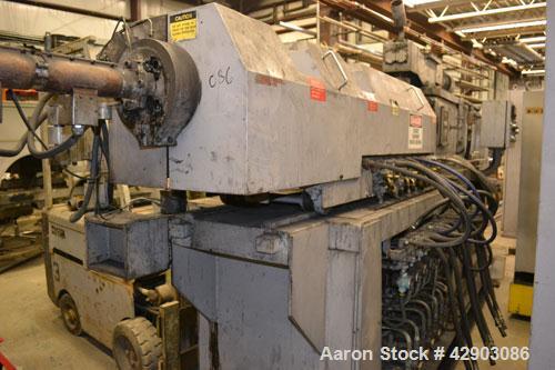 Used Ikegai 65mm Twin Screw Extruder, Model PCM-65II. Liquid heated, and cooled. 8 Zone top vented barrel. Top mounted twin screw feeder. Approximate 64" centerline height. Extruder driven by a 55kw ...