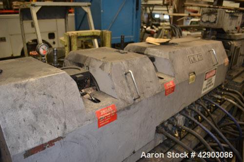 Used Ikegai 65mm Twin Screw Extruder, Model PCM-65II. Liquid heated, and cooled. 8 Zone top vented barrel. Top mounted twin screw feeder. Approximate 64" centerline height. Extruder driven by a 55kw ...