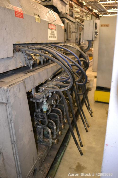 Used Ikegai 65mm Twin Screw Extruder, Model PCM-65II. Liquid heated, and cooled. 8 Zone top vented barrel. Top mounted twin screw feeder. Approximate 64" centerline height. Extruder driven by a 55kw ...
