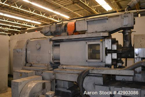Used Ikegai 65mm Twin Screw Extruder, Model PCM-65II. Liquid heated, and cooled. 8 Zone top vented barrel. Top mounted twin screw feeder. Approximate 64" centerline height. Extruder driven by a 55kw ...