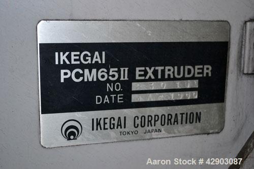 Used Ikegai 65mm Twin Screw Extruder, Model PCM-65II. Liquid heated, and cooled. 8 Zone top vented barrel. Top mounted twin screw feeder. Approximate 64" centerline height. Extruder driven by a 75kw ...