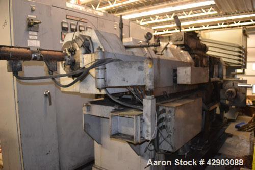 Used Ikegai 65mm Twin Screw Extruder, Model PCM-65II. Liquid heated, and cooled. 8 Zone top vented barrel. Top mounted twin screw feeder. Approximate 64" centerline height. Extruder driven by a 55kw ...