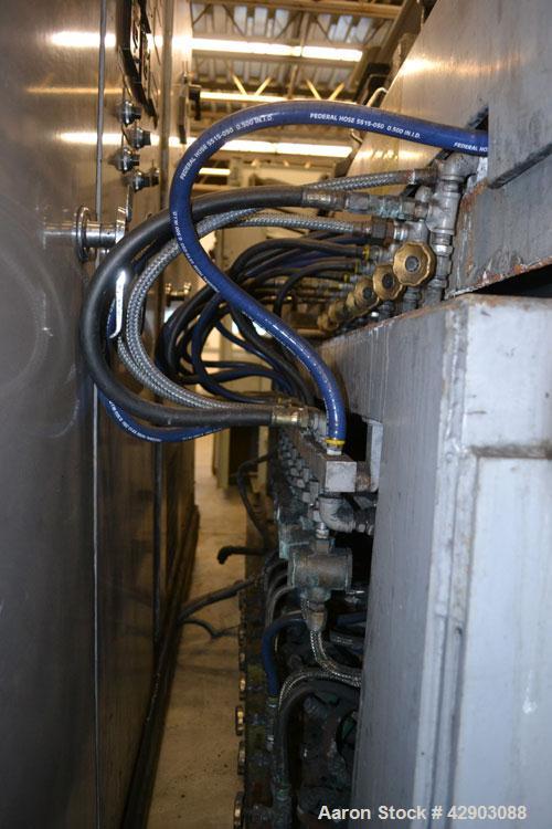 Used Ikegai 65mm Twin Screw Extruder, Model PCM-65II. Liquid heated, and cooled. 8 Zone top vented barrel. Top mounted twin screw feeder. Approximate 64" centerline height. Extruder driven by a 55kw ...