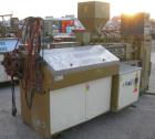 USED: Amut twin screw extruder, 92 mm screw diameter, model BA92. Approximate 22:1 L/D ratio. Counter-rotating screw design. 5 zone top vented, electrically heated, air cooled barrel with vacuum pump...