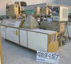 USED: Amut twin screw extruder, 92 mm screw diameter, model BA92. Approximate 24:1 L/D ratio. Counter-rotating screw design. 6 zone top vented, electrically heated, air cooled barrel with vacuum pump...
