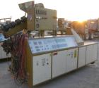 USED: Amut twin screw extruder, 92 mm screw diameter, model BA92. Approximate 24:1 L/D ratio. Counter-rotating screw design. 6 zone top vented, electrically heated, air cooled barrel with vacuum pump...