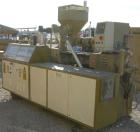 USED: Amut twin screw extruder, 92 mm screw diameter, model BA92. Approximate 24:1 L/D ratio, counter rotating screw design, 6 zone top vented electrically heated, air cooled barrel with vacuum pump....