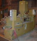 USED: Amut twin screw extruder, 92 mm screw diameter, model BA92. Approximate 22:1 L/D ratio. Counter-rotating screw design. 5 zone top vented, electrically heated, air cooled barrel with vacuum pump...