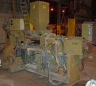 USED: Amut twin screw extruder, 92 mm screw diameter, model BA92. Approximate 22:1 L/D ratio. Counter-rotating screw design. 5 zone top vented, electrically heated, air cooled barrel with vacuum pump...