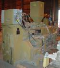 USED: Amut twin screw extruder, 92 mm screw diameter, model BA92. Approximate 22:1 L/D ratio. Counter-rotating screw design. 5 zone top vented, electrically heated, air cooled barrel with vacuum pump...