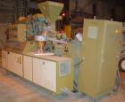 USED: Amut twin screw extruder, 92 mm screw diameter, model BA92. Approximate 24:1 L/D ratio, counter-rotating screw design. 6 zone top vented, electrically heated, air cooled barrel with vacuum pump...