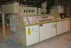 USED: Amut twin screw extruder, 92 mm screw diameter, model BA92. Approximate 22:1 L/D ratio. Counter-rotating screw design. 5 zone top vented, electrically heated, air cooled barrel with vacuum pump...