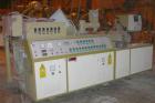 USED: Amut twin screw extruder, 92 mm screw diameter, model BA92. Approximate 22:1 L/D ratio. Counter-rotating screw design. 5 zone top vented, electrically heated, air cooled barrel with vacuum pump...