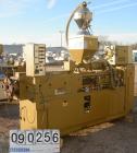 USED: Amut twin screw extruder, 92 mm screw diameter, model BA92.Approximate 22:1 L/D ratio. Counter-rotating screw design. 5 zonetop vented, electrically heated, air cooled barrel with vacuum pump.W...