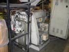 USED: Luigi Bandera 45mm extruder. 460 volt, 3 phase, 20 hp DC; Barrier Maddock style screw; 3 barrel zones with fan cooling; Athena X-25 temperature controllers; extrusion head with swing arm; clams...