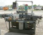 Used Cincinnati Milacron model CM35 35mm conical counter rotating twin screw extrusion equipment. New 2000. Extruder serial #E50A0200003. Has 8 zone temperature control panel utilizing Barber Coleman...