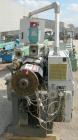 Used Cincinnati Milacron model CM35 35mm conical counter rotating twin screw extrusion equipment. New 2000. Extruder serial #E50A0200003. Has 8 zone temperature control panel utilizing Barber Coleman...