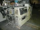 Used Cincinnati Milicron Conical Counter-Rotating Twin Screw Extruder, 35 mm, model CM35. Electrically heated, water cooled vented barrel with pump. Water cooled feed throat with a dosing feeder. App...