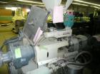 Used Cincinnati Milicron Conical Counter-Rotating Twin Screw Extruder, 35 mm, model CM35. Electrically heated, water cooled vented barrel with pump. Water cooled feed throat with a dosing feeder. App...