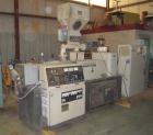 Used Cincinnati Milicron Conical Counter-Rotating Twin Screw Extruder, 55 mm, model CM55HP. Electrically heated, water cooled vented barrel with pump. Water cooled feed throat with a dosing feeder. A...