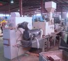 Used Cincinnati Milicron Conical Counter-Rotating Twin Screw Extruder, 55 mm, model CM55HP. Electrically heated, water cooled vented barrel with pump. Water cooled feed throat with a dosing feeder. A...