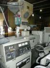 Used Cincinnati Milicron Conical Counter-Rotating Twin Screw Extruder, 55 mm, model CM55HP. Electrically heated, water cooled vented barrel with pump. Water cooled feed throat with a dosing feeder. A...