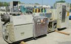 Used Cincinnati Milicron Conical Counter-Rotating Twin Screw Extruder, 80 mm, model CM80HP. Electrically heated, water cooled vented barrel with pump. Water cooled feed throat with a crammer feeder. ...
