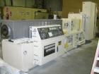 USED: Cincinnati counter-rotating twin screw extruder, 92 mm, model CM92HP. Electrically heated, water cooled 5 zone top vented barrel with tank, heat exchanger and pump. Built-in oil cooling/heating...