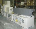 USED: Cincinnati counter-rotating twin screw extruder, 92 mm, model CM92HP. Electrically heated, water cooled 5 zone top vented barrel with tank, heat exchanger and pump. Built-in oil cooling/heating...
