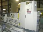 USED: Cincinnati counter-rotating twin screw extruder, 92 mm, model CM92HP. Electrically heated, water cooled 5 zone top vented barrel with tank, heat exchanger and pump. Built-in oil cooling/heating...