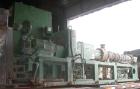 USED: Cincinnati counter-rotating twin screw extruder, 92 mm, model CM92HP. Electrically heated, water cooled 5 zone top vented barrel with tank, heat exchanger and pump. Built-in oil cooling/heating...