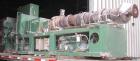 USED: Cincinnati counter-rotating twin screw extruder, 92 mm, model CM92HP. Electrically heated, water cooled 5 zone top vented barrel with tank, heat exchanger and pump. Built-in oil cooling/heating...