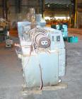 USED: Cincinnati Milacron Model CM-65HP Conical Twin Screw Counter-Rotating Extruder having an electrically heated, liquid cooled and vented barrel at an approximate 42