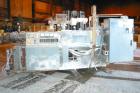 USED: Cincinnati Milacron Model CM-65HP Conical Twin Screw Counter-Rotating Extruder having an electrically heated, liquid cooled and vented barrel at an approximate 42