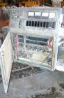 USED: Cincinnati Milacron Model CM-65HP Conical Twin Screw Counter-Rotating Extruder having an electrically heated, liquid cooled and vented barrel at an approximate 42