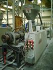 Used Cincinnati Twin-Screw Extruder Conical Milacron CMT 80-L. Year of production: 1995. Work hours: 39218 h D.C. shunt motor: 46kW Rating, installed and set: 1480.0 min-1 Speed: 297 Nm Torque: 0.7 k...
