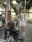 Used Cincinnati Twin-Screw Extruder Conical Milacron CMT 80-L. Year of production: 1995. Work hours: 39218 h D.C. shunt motor: 46kW Rating, installed and set: 1480.0 min-1 Speed: 297 Nm Torque: 0.7 k...