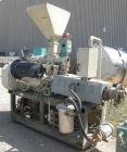 Used Cincinnati Milicron Conical Counter-Rotating Twin Screw Extruder, 55 mm, model E55 Pinnacle. Electrically heated, water cooled 4 zone vented barrel with pump. Water cooled feed throat with a dos...